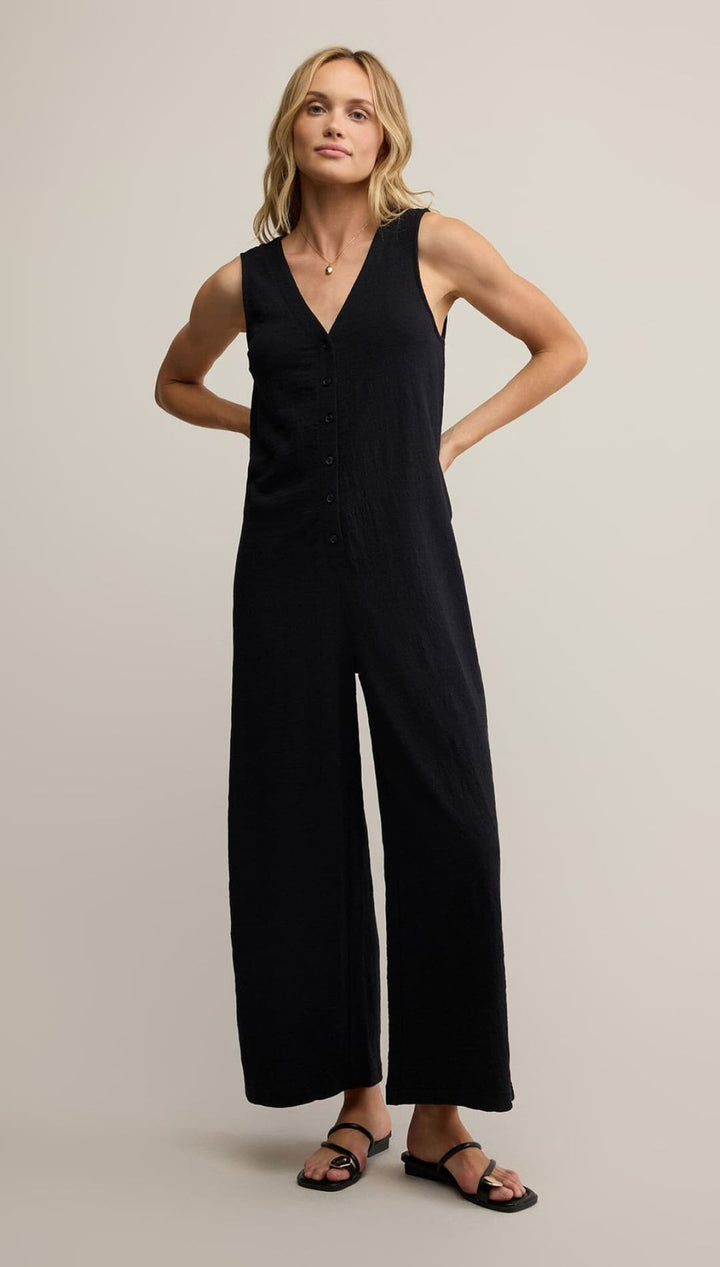 Black jumpsuit with wide-leg design and v-neckline, made of stretchy fabric.