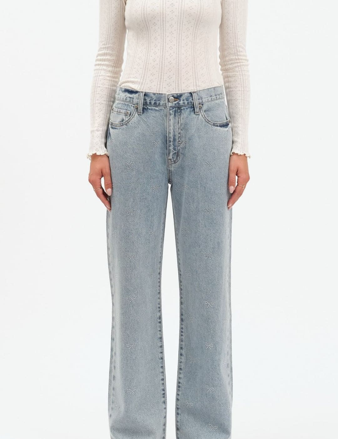 Light blue denim jeans with a relaxed fit and black stitching.