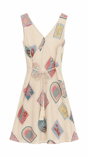 Beige dress with colorful geometric pattern on a white background