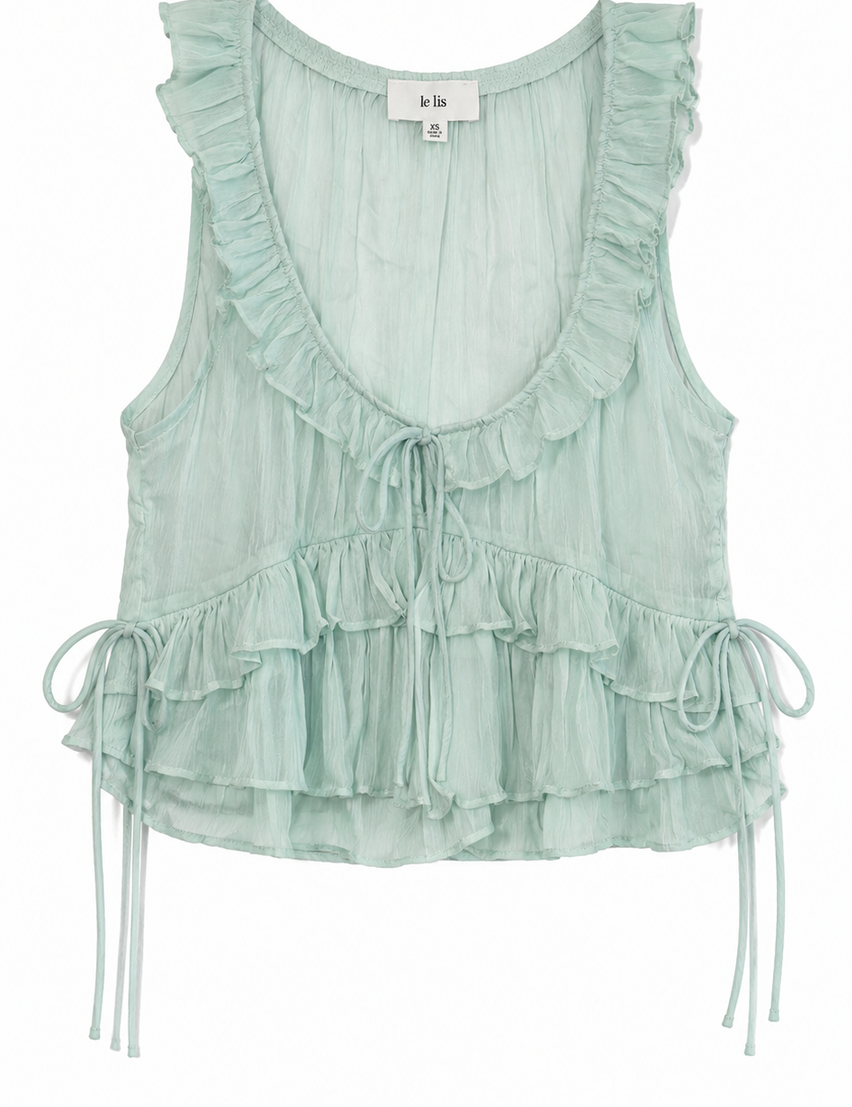 Light green ruffled top on a white background