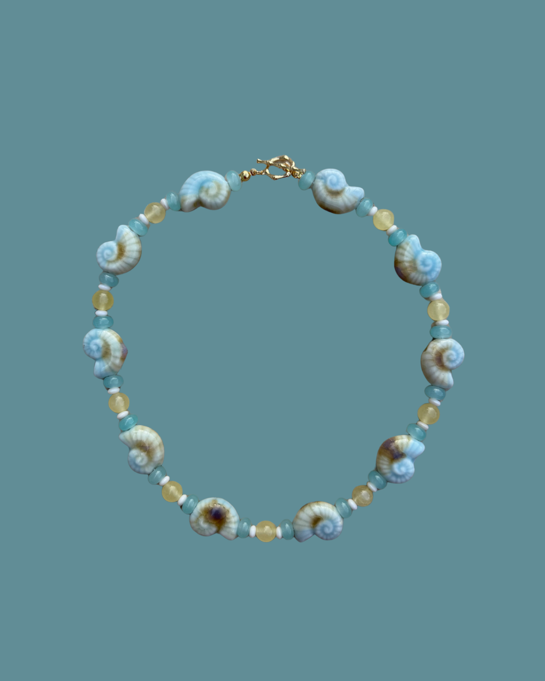 Details_Length_15.5_inches_with_2_inch_extender_Materials_Genuine_lapis_irregular_nuggets_24k_gold_filled_fish_charms_Closure_18k_gold_filled_clasp_Care_Tips_To_keep_your_piece_lookin_181a0c7f-30b8-419b-a26c-3ff98ba916a7.png