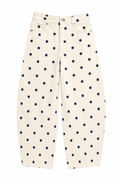 White pants with navy blue polka dots on a white background