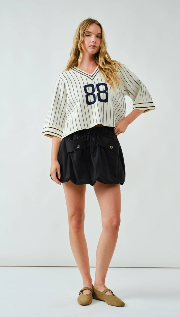 88 jersey short sleeve top with pinstripes and number 88 on the front.