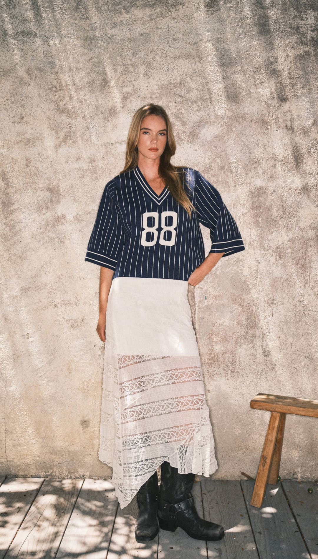 Navy blue and white striped jersey with the number 88, made of cotton.