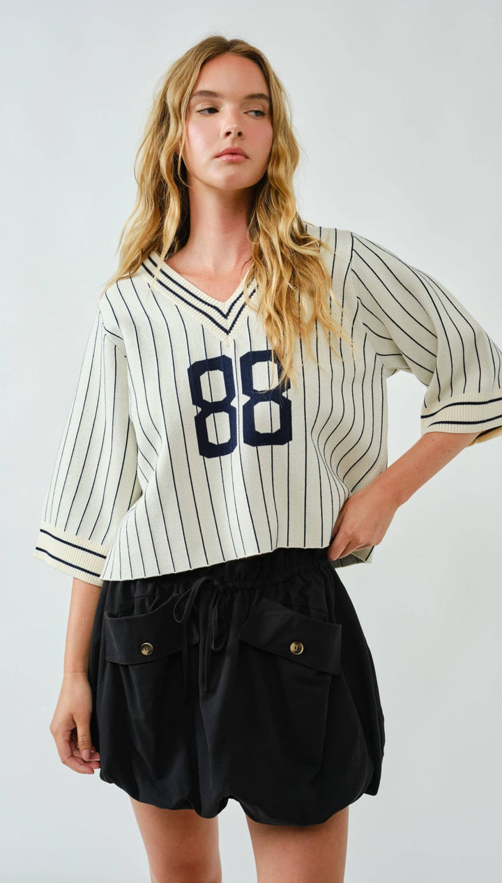 Striped baseball jersey with the number 88 in navy blue on a white background, made of cotton and polyester blend.