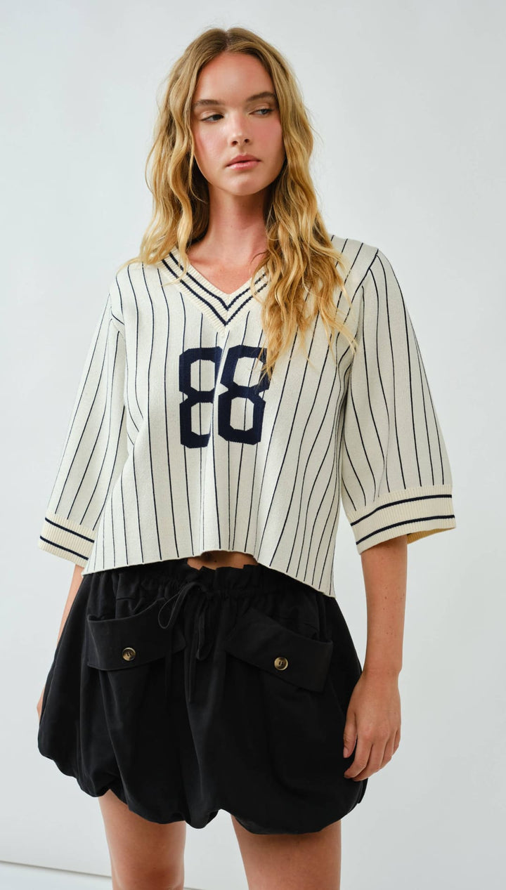 Striped baseball jersey with the number 88 in navy blue on a white background, made of cotton and polyester blend.