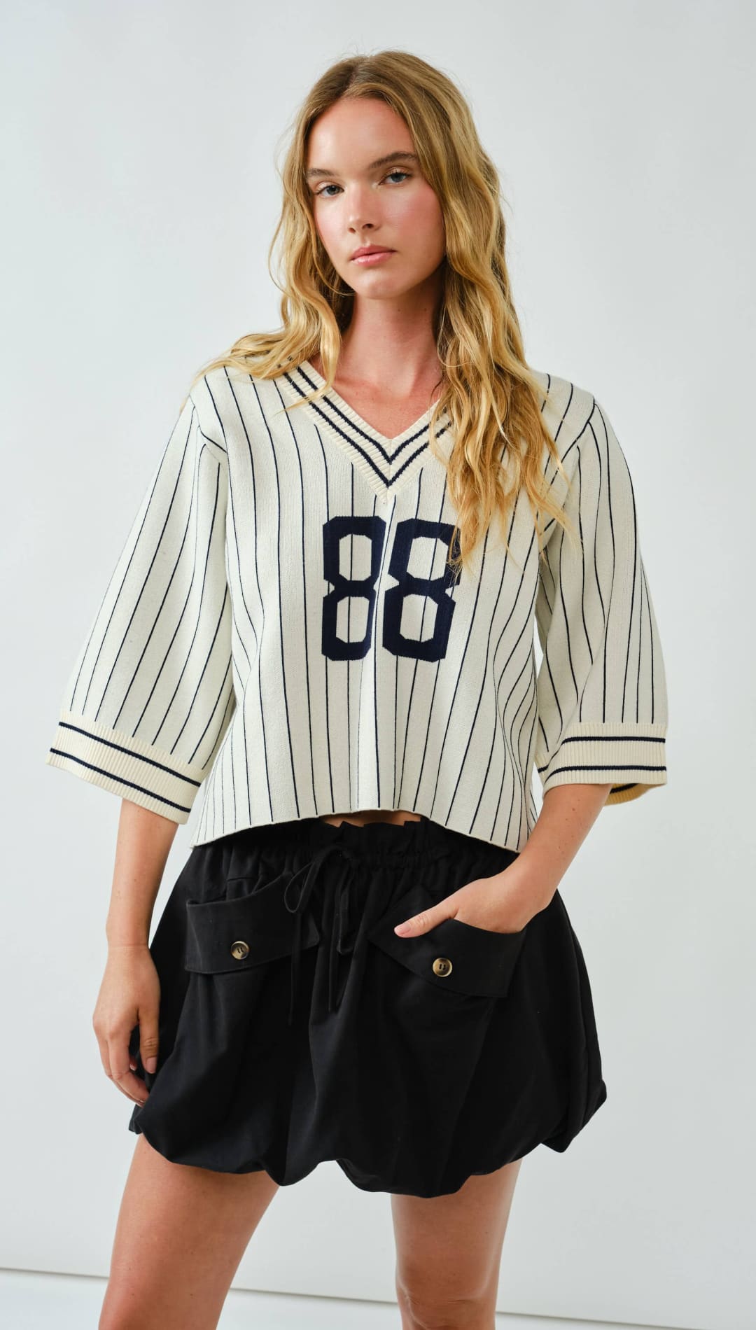 Striped baseball jersey with navy number 88 and gold accents.