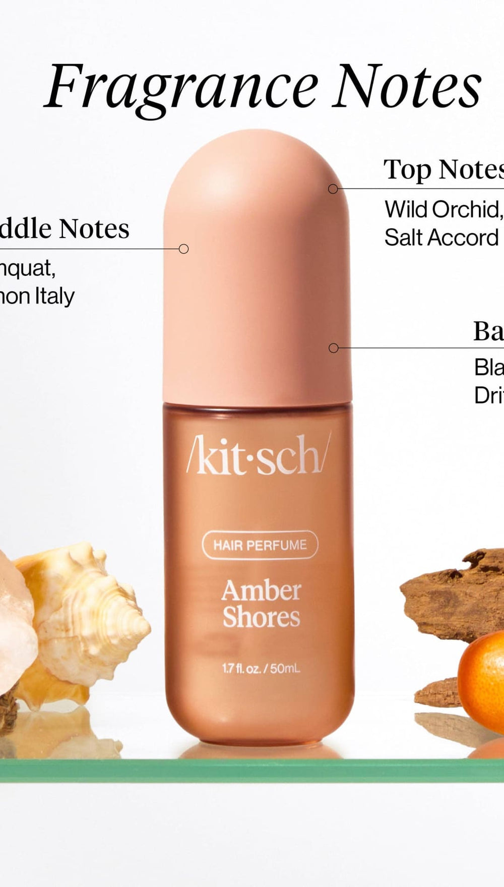 Amber shores perfume bottle with peach-colored cap and gold label, featuring a minimalist design.