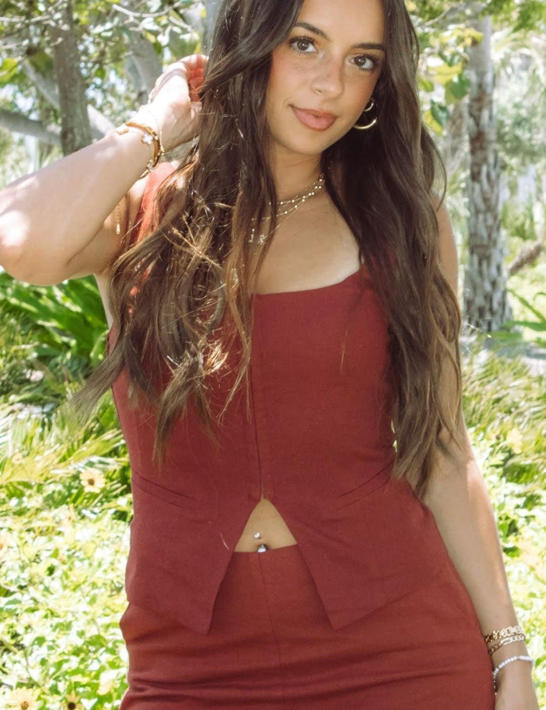 Woman in matching rust-colored shorts and top.