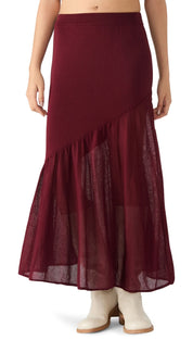 A long, dark red skirt with a sheer, ruffled hem and an asymmetrical design.