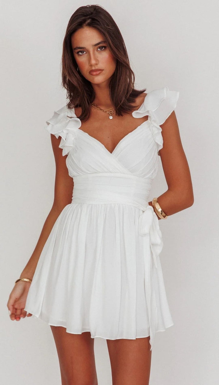 White ruffled mini dress.