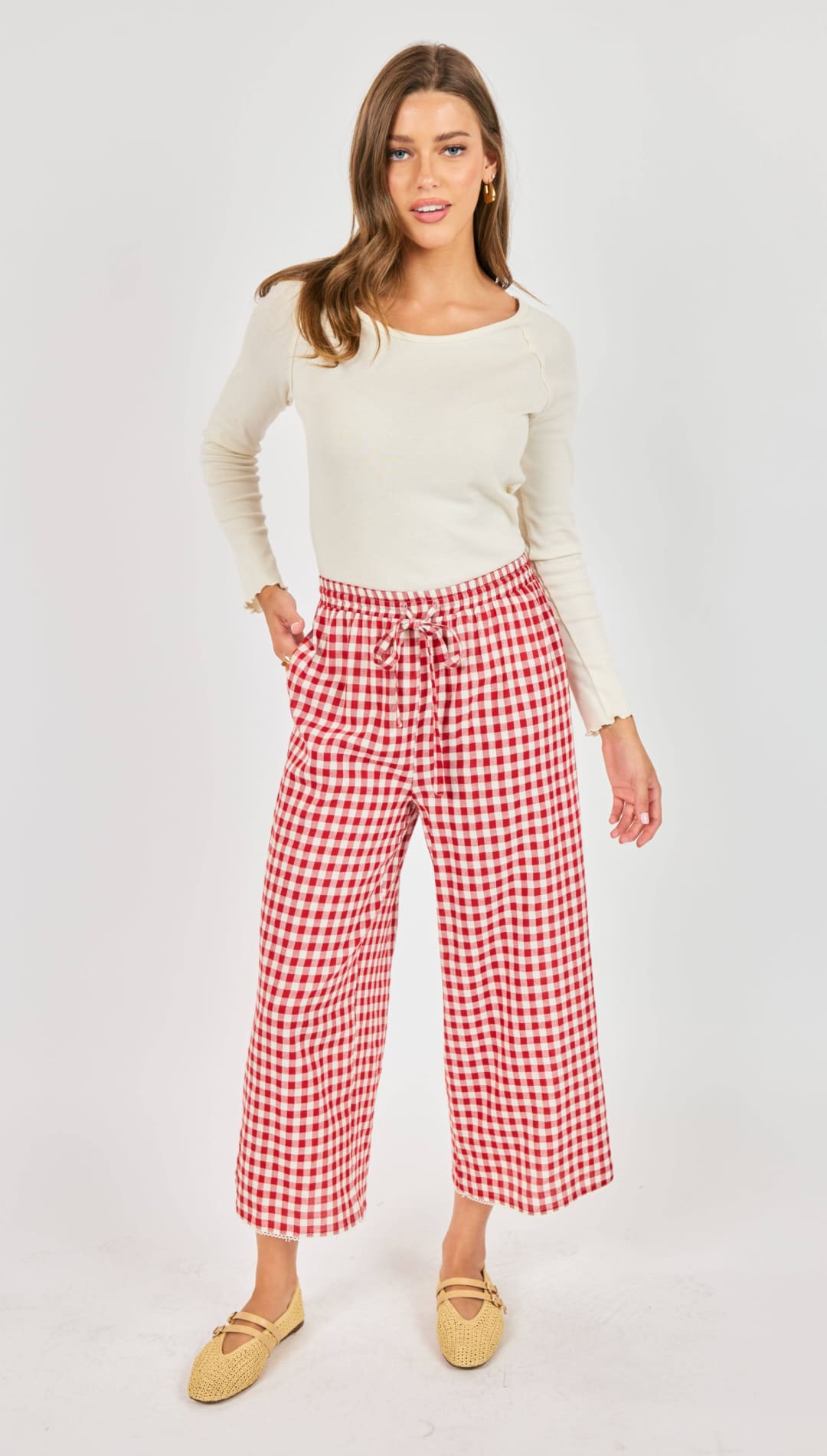 Red and white gingham wide-leg pants with a drawstring waist.