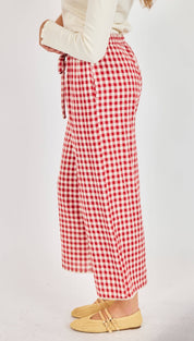 Red and white gingham wide-leg trousers with a drawstring waist.