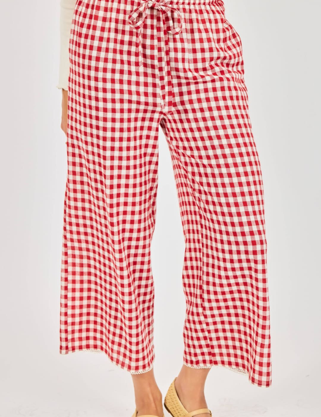 Red and white gingham wide-leg pants with a drawstring waistband.