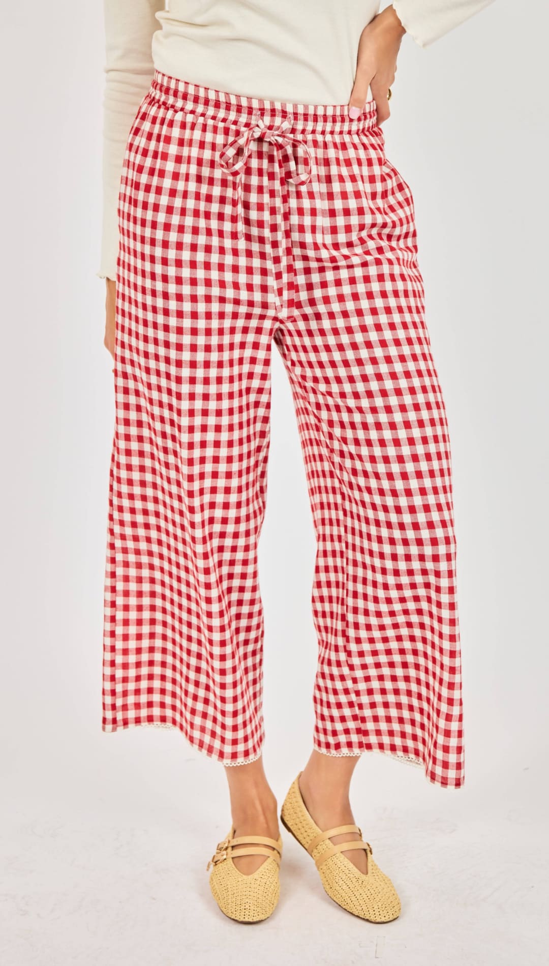 Red and white gingham wide-leg pants with a drawstring waistband.