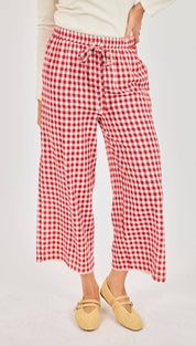 Red and white gingham wide-leg pants with a drawstring waistband.