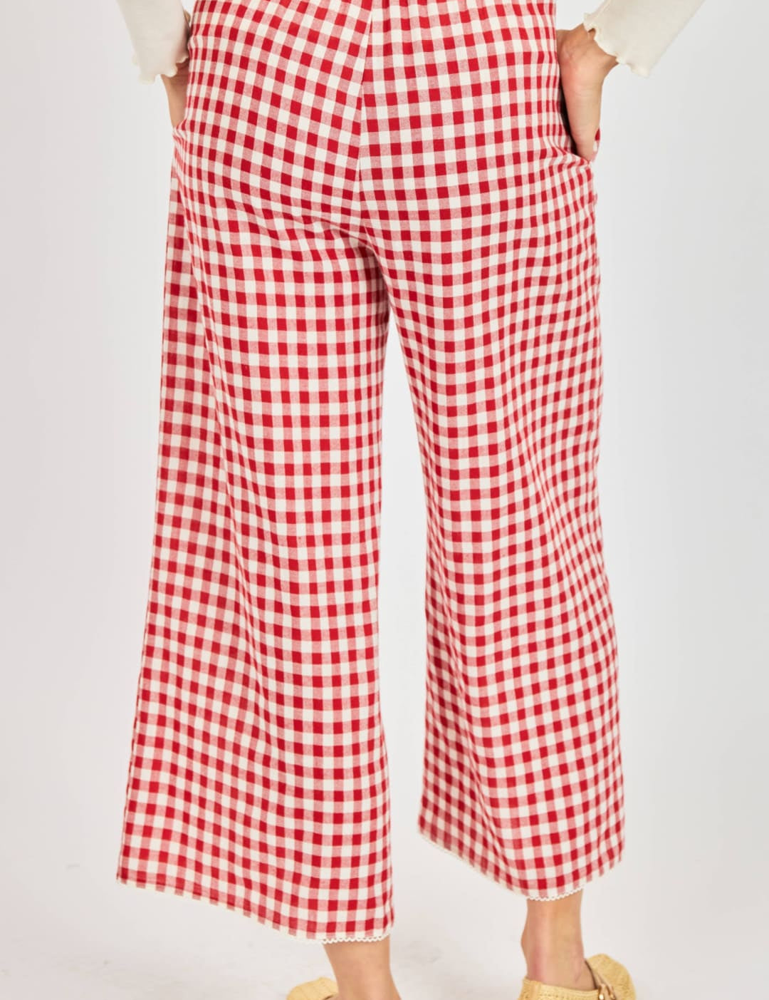Red and white gingham wide-leg trousers.