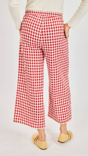 Red and white gingham wide-leg trousers.