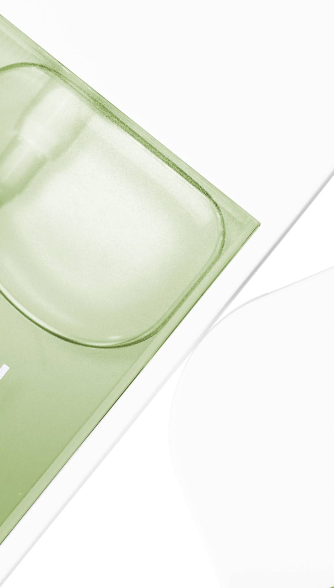 Green and white orchid petal-shaped facial mask with a hand icon.