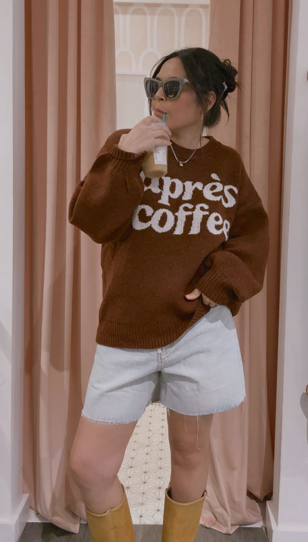 Brown ’apres coffee’ sweatshirt with white lettering and yellow boots.