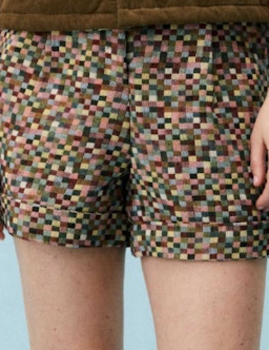 Brown and green pixelated patterned shorts.