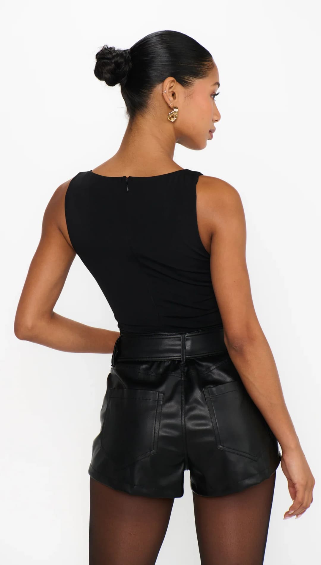 Black leather shorts with a tie waist and high rise design.