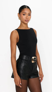Black leather high-waisted shorts with gold buckle belt