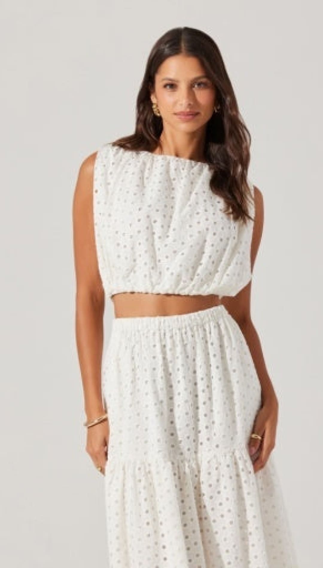 White eyelet crop top and skirt set.