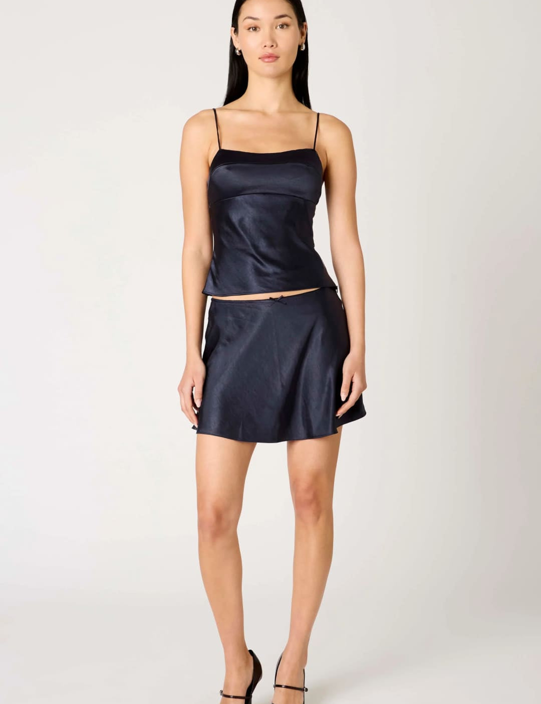 Satin navy blue camisole and mini skirt set.