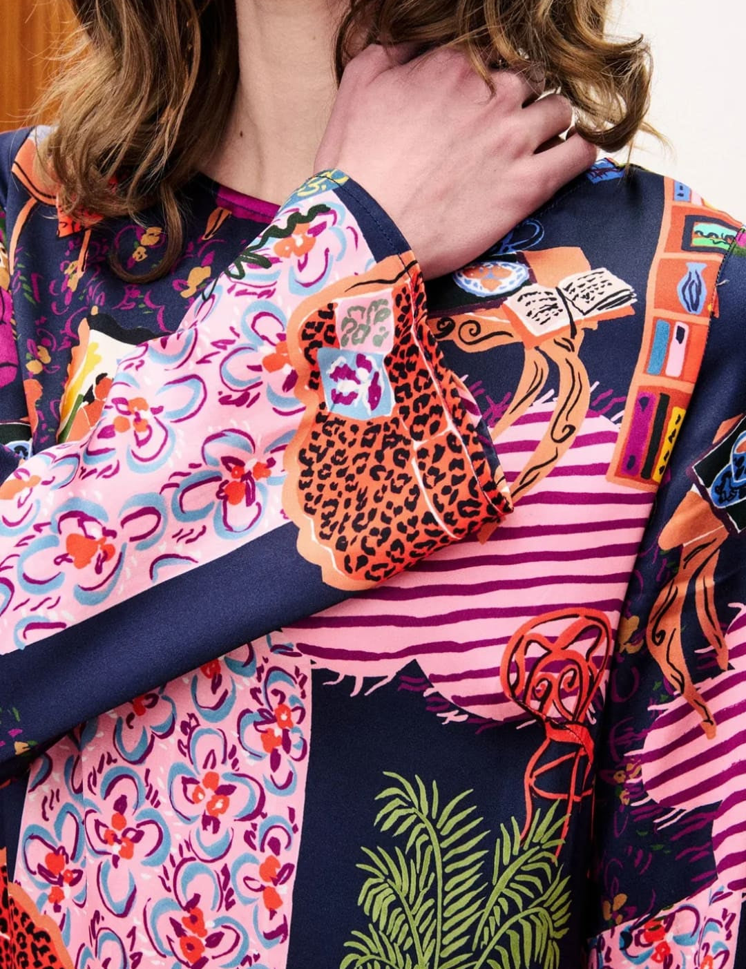 Multicolored patchwork blouse with floral and geometric patterns, likely made of silk or polyester blend.