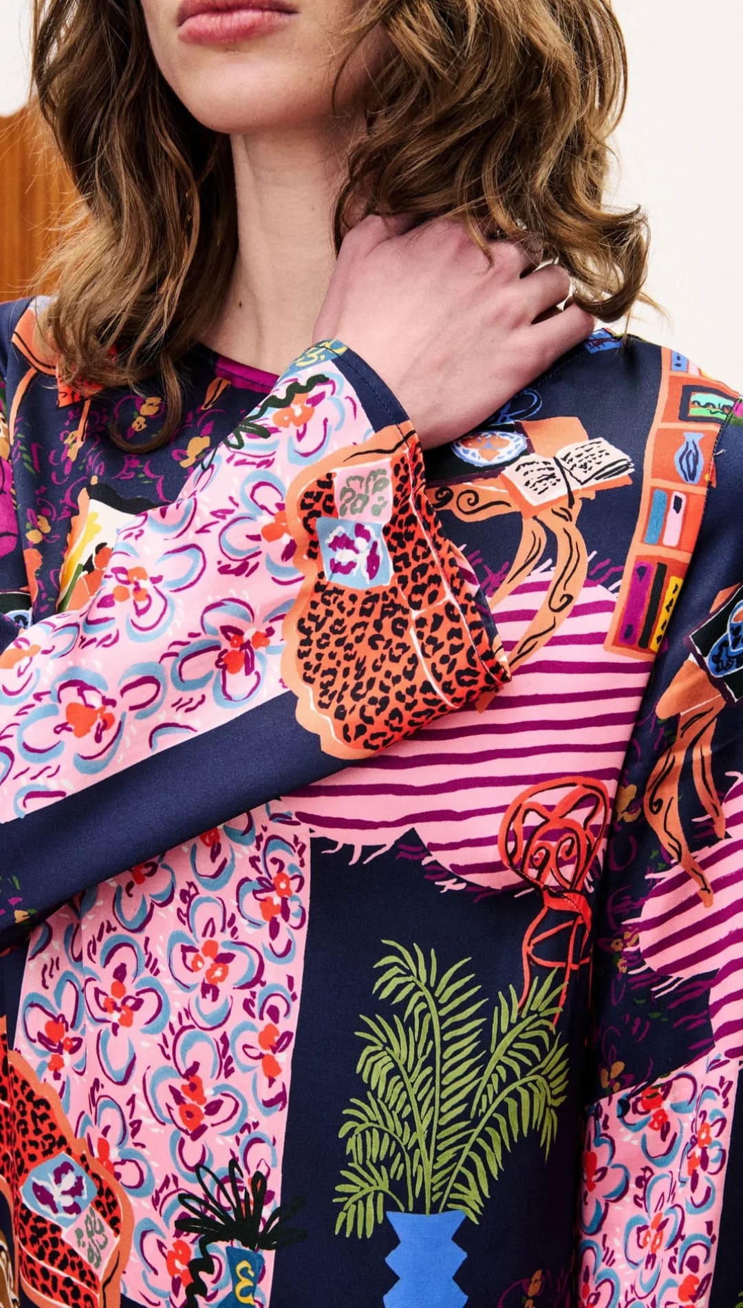 Multicolored patchwork blouse with floral and geometric patterns, likely made of silk or polyester blend.