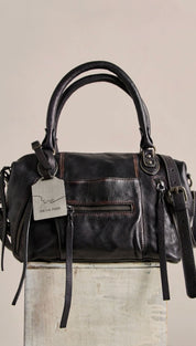 Black leather handbag with dual top handles and a detachable shoulder strap.