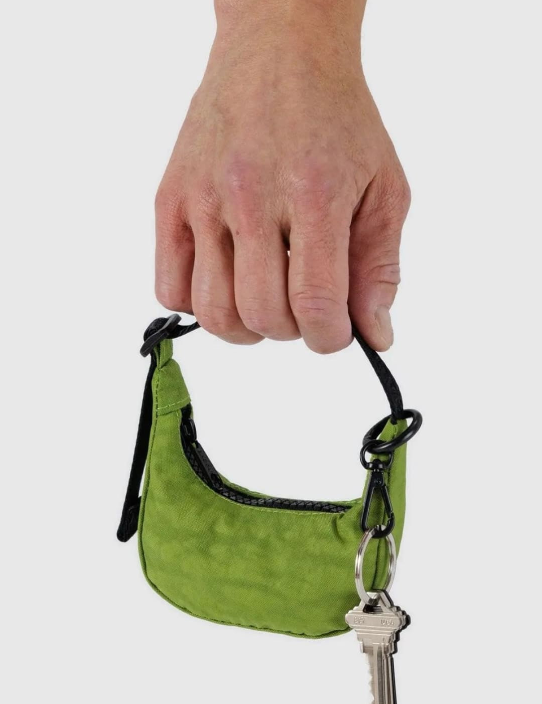 Green mini purse with key.