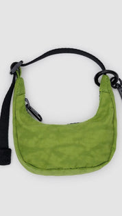 Green nylon crescent bag with black strap.