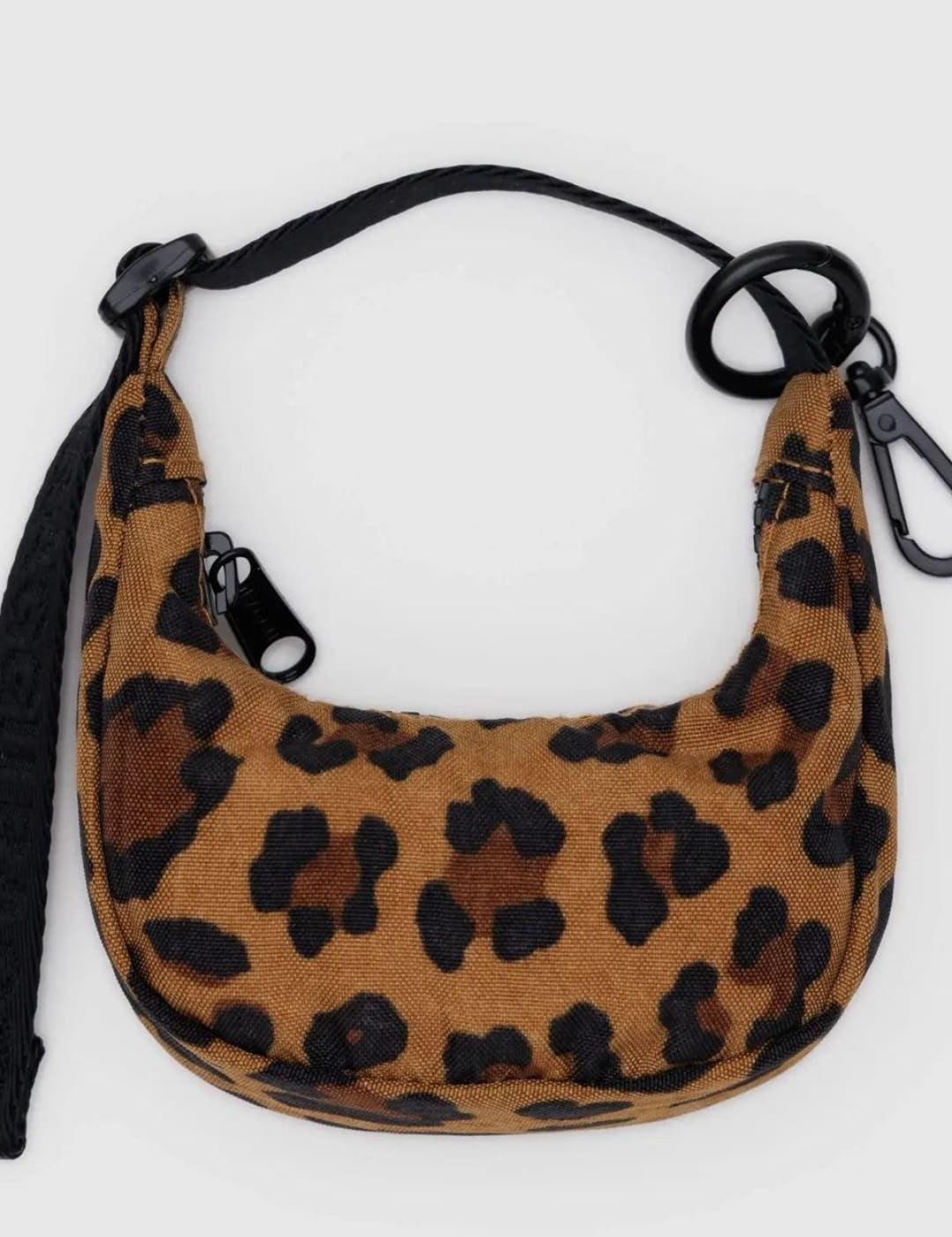 Leopard print crescent bag with black strap.