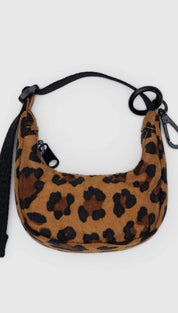 Leopard print crescent bag with black strap.