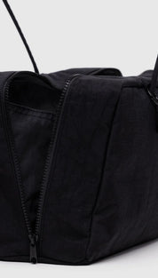 Black nylon tote bag with zipper closure and adjustable shoulder straps.