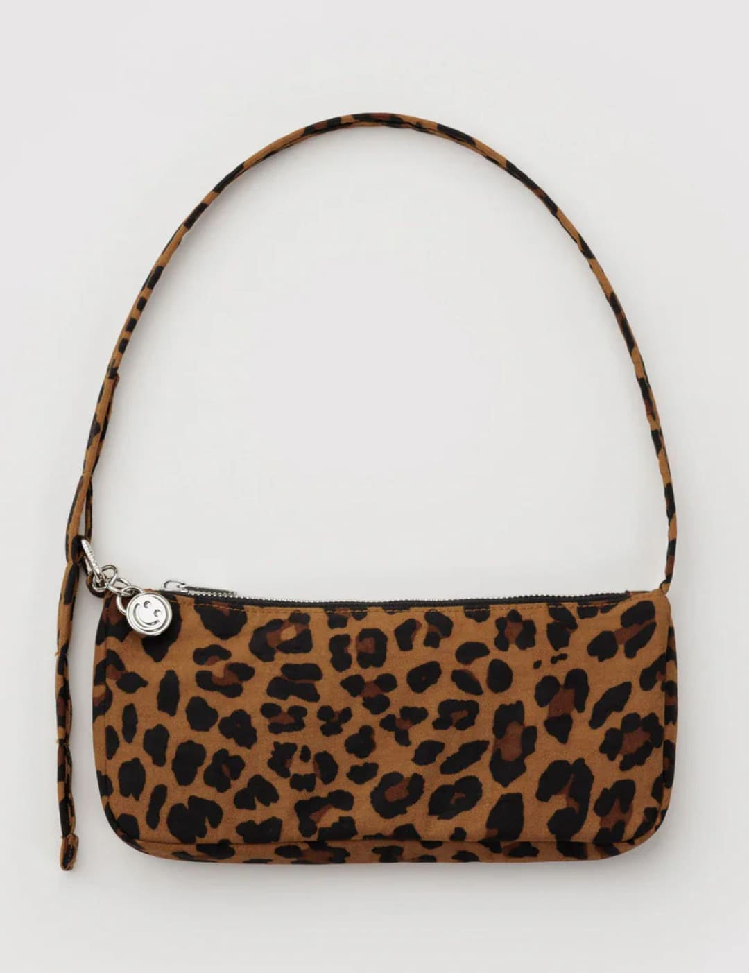 Leopard print handbag with a single shoulder strap and silver button closure.