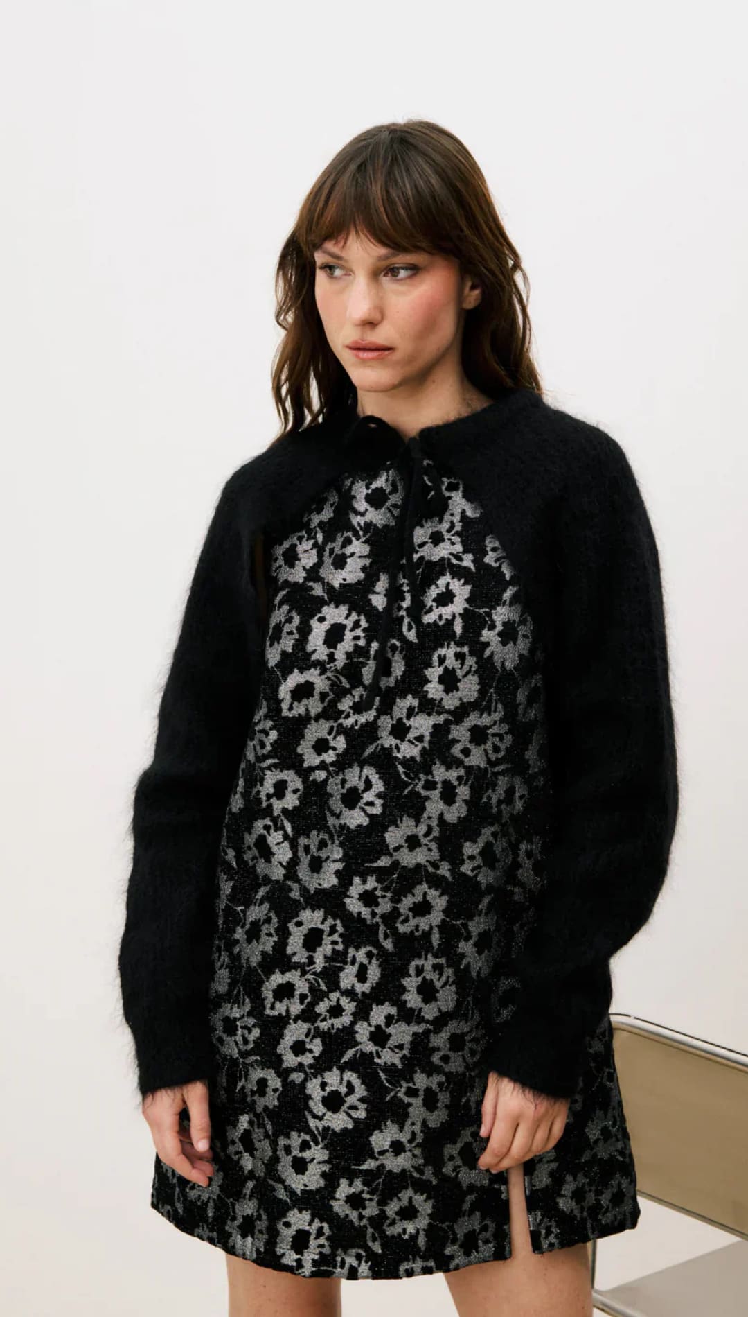 Black floral dress with silver accents, soft fabric.