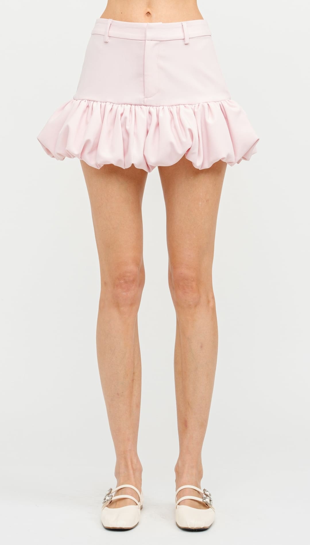 Light pink bubble-hem mini skirt with a gathered waist.