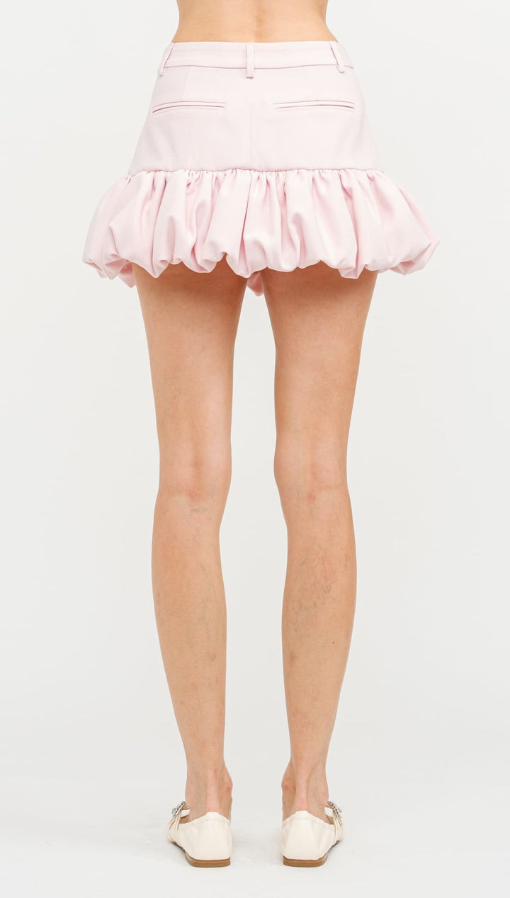 Light pink bubble-hem mini skirt with a gathered waistline.