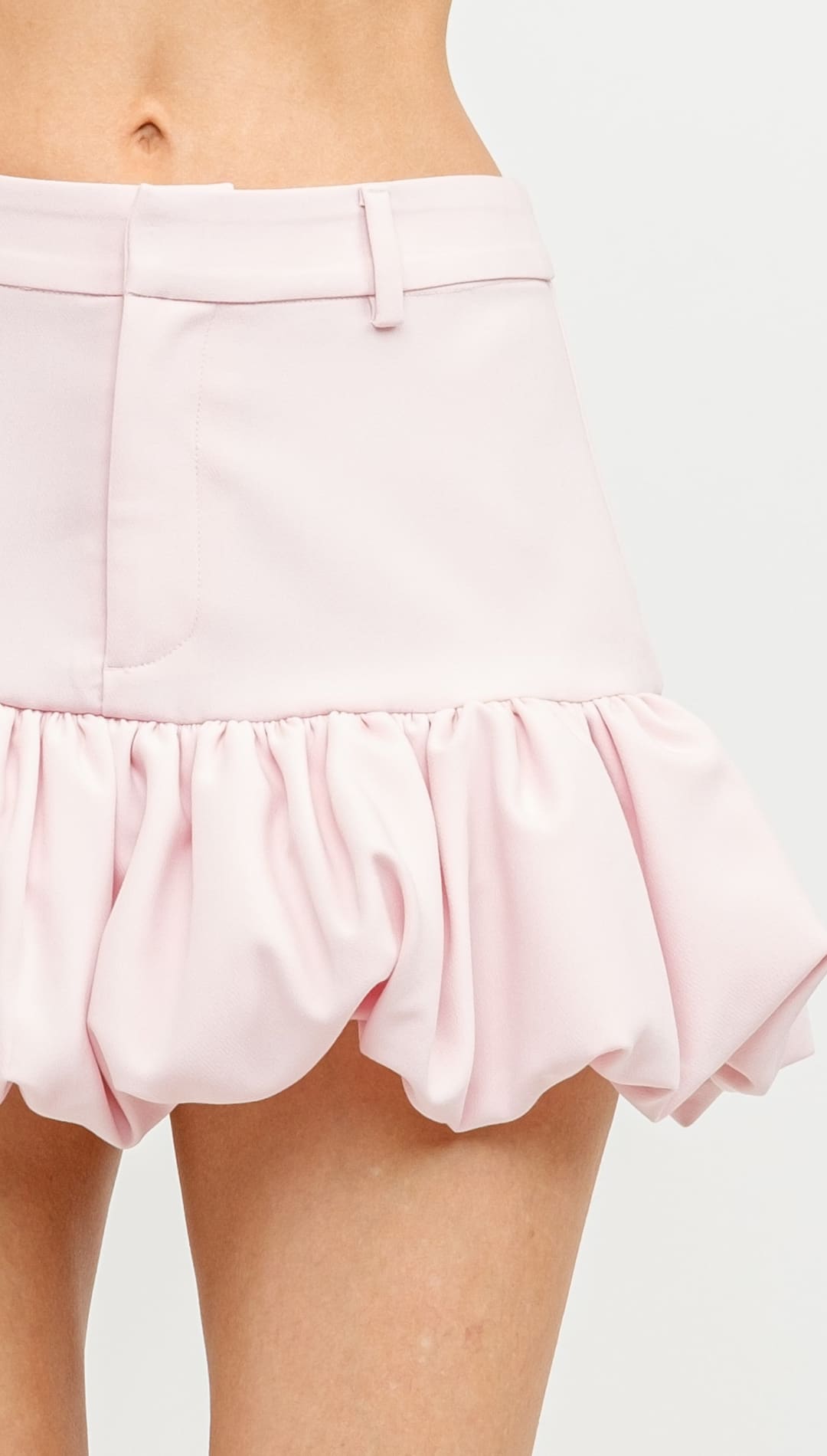 Pink ruffled bubble shorts with a fitted waistband.