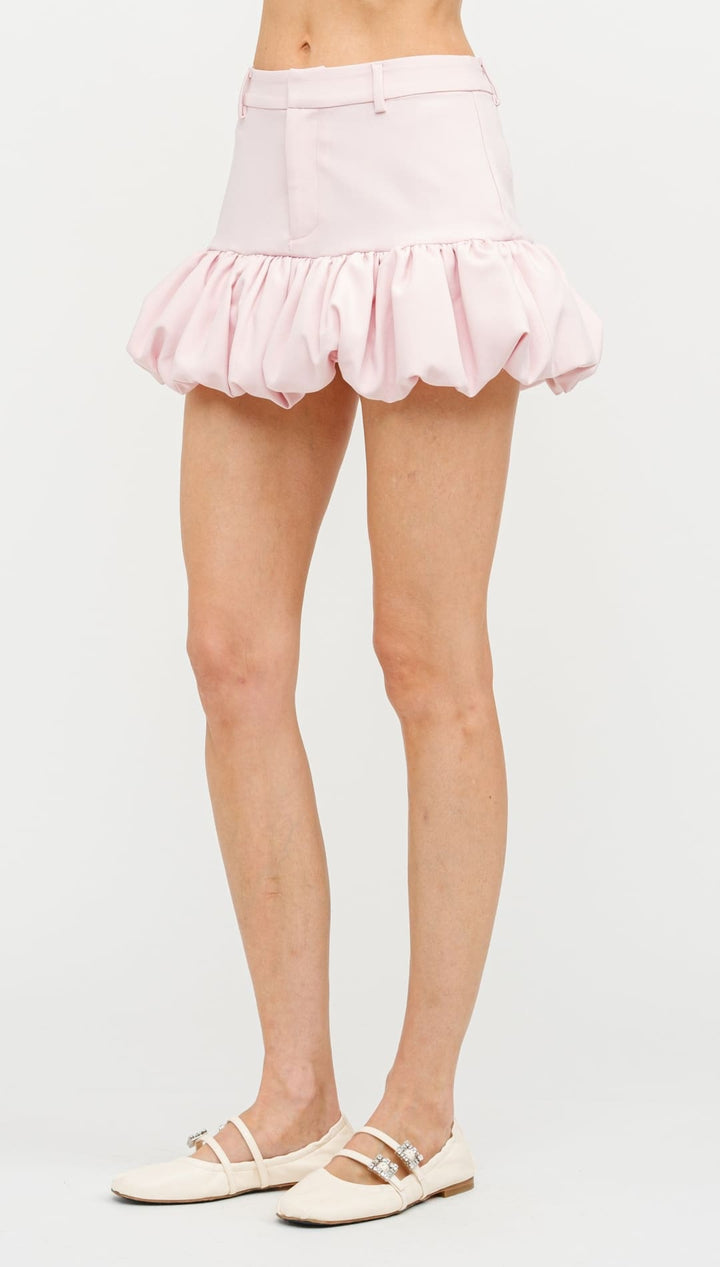 Pink ruffled mini skirt with a bubble hem.