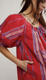 Red striped dress with puffy sleeves.