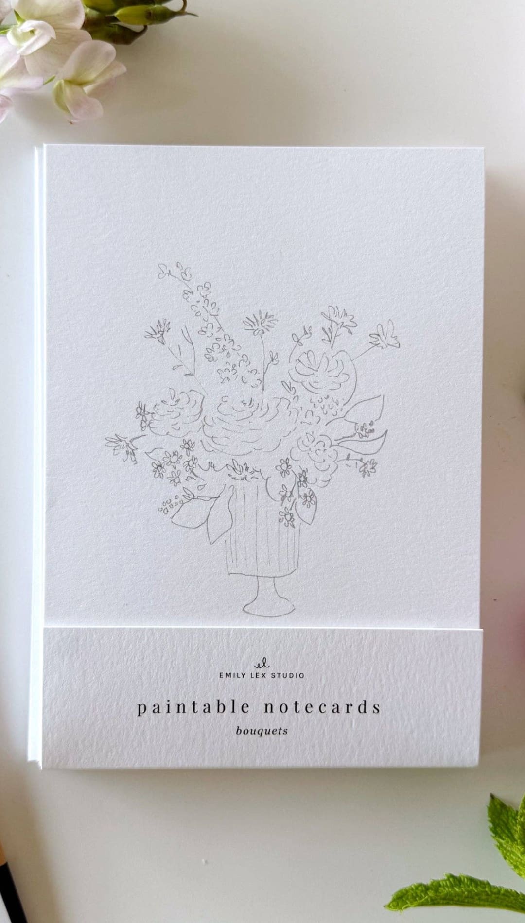 White floral notecards with a vase design, watercolor finish.