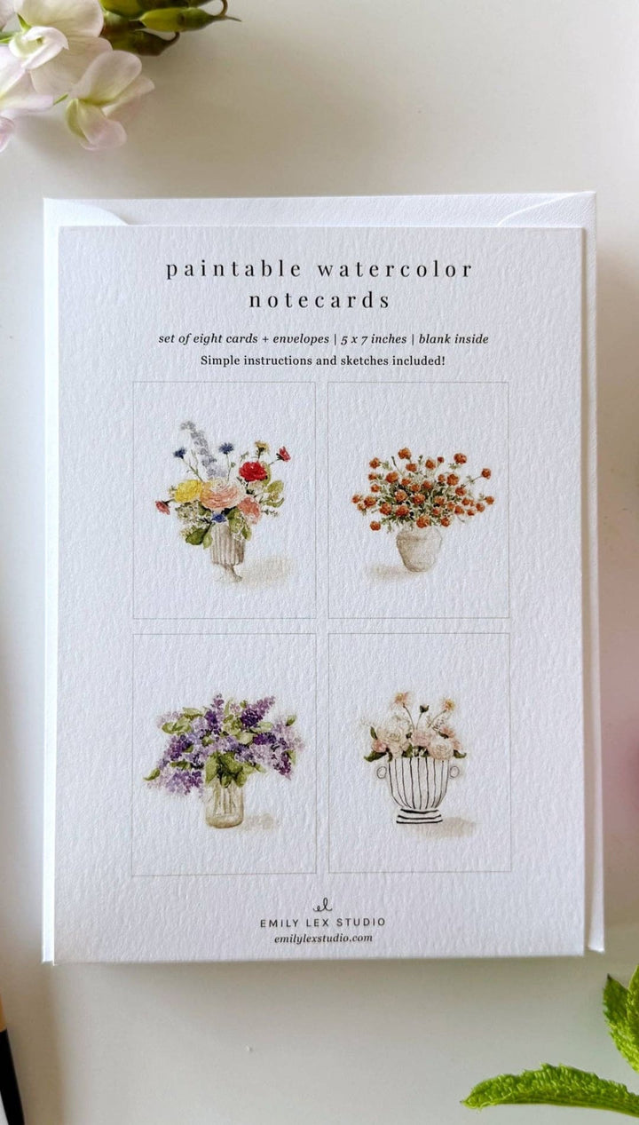 White paintable watercolor notecards with floral designs in pastel hues and gold accents.emily lee studio