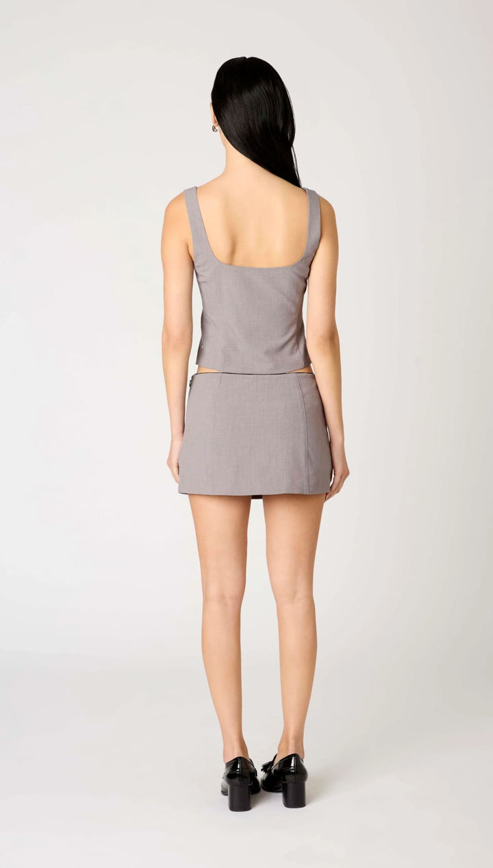 A woman’s sleeveless gray tank top and matching mini skirt.