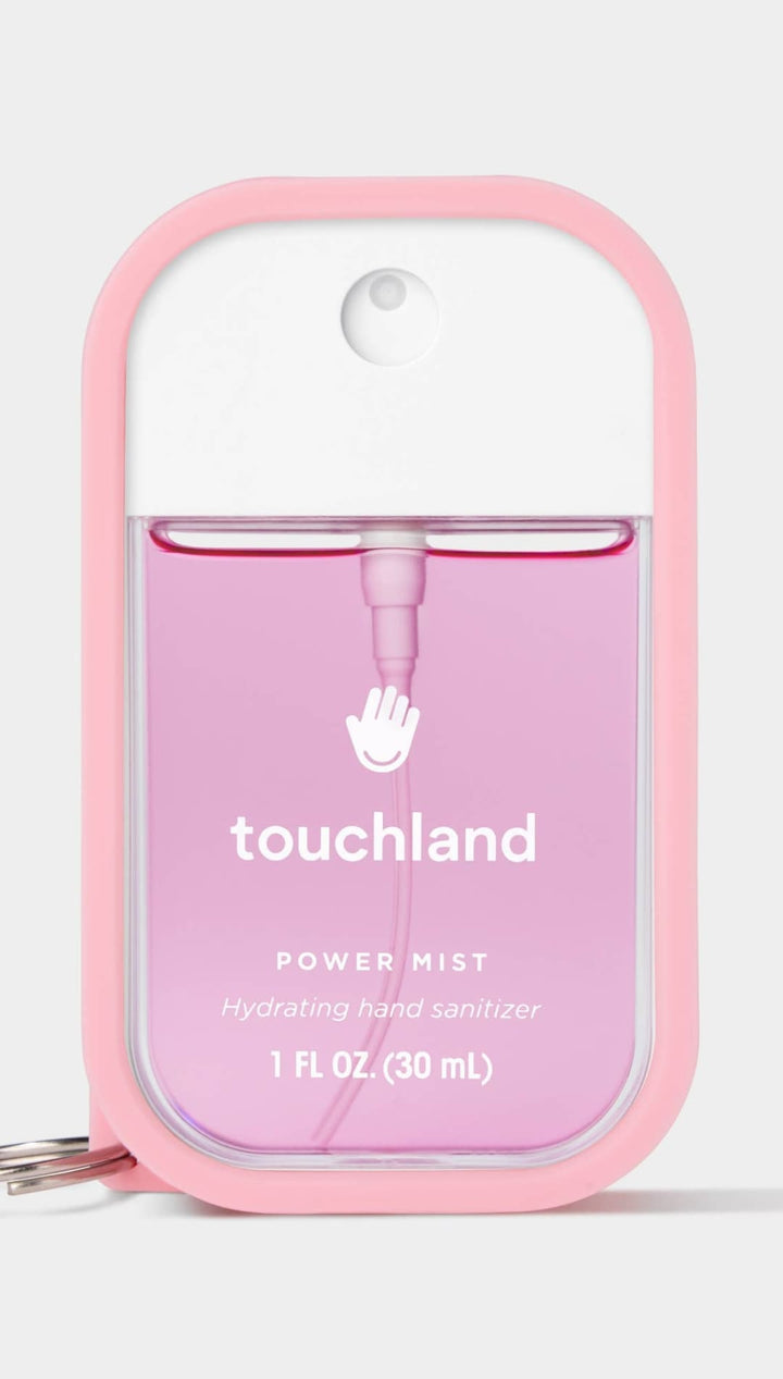 Pink and clear touchland power mist hand sanitizer with keychain.