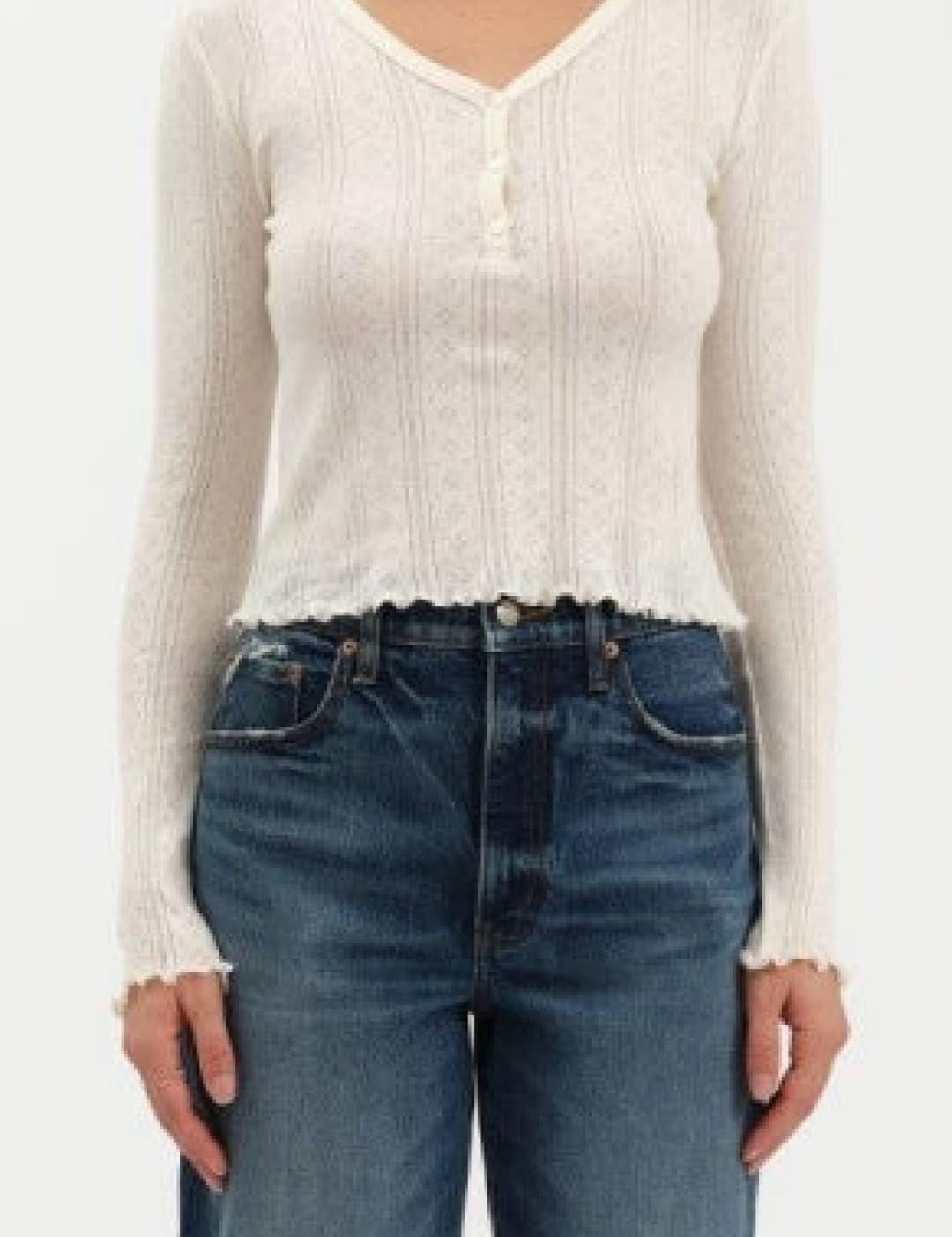White long-sleeved top with buttons.