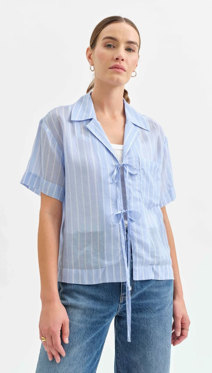 Light blue striped short-sleeve blouse with front tie closures.